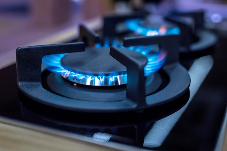 closeup of gas burners on a stove