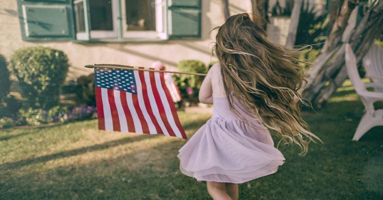 Girl running with small flag
